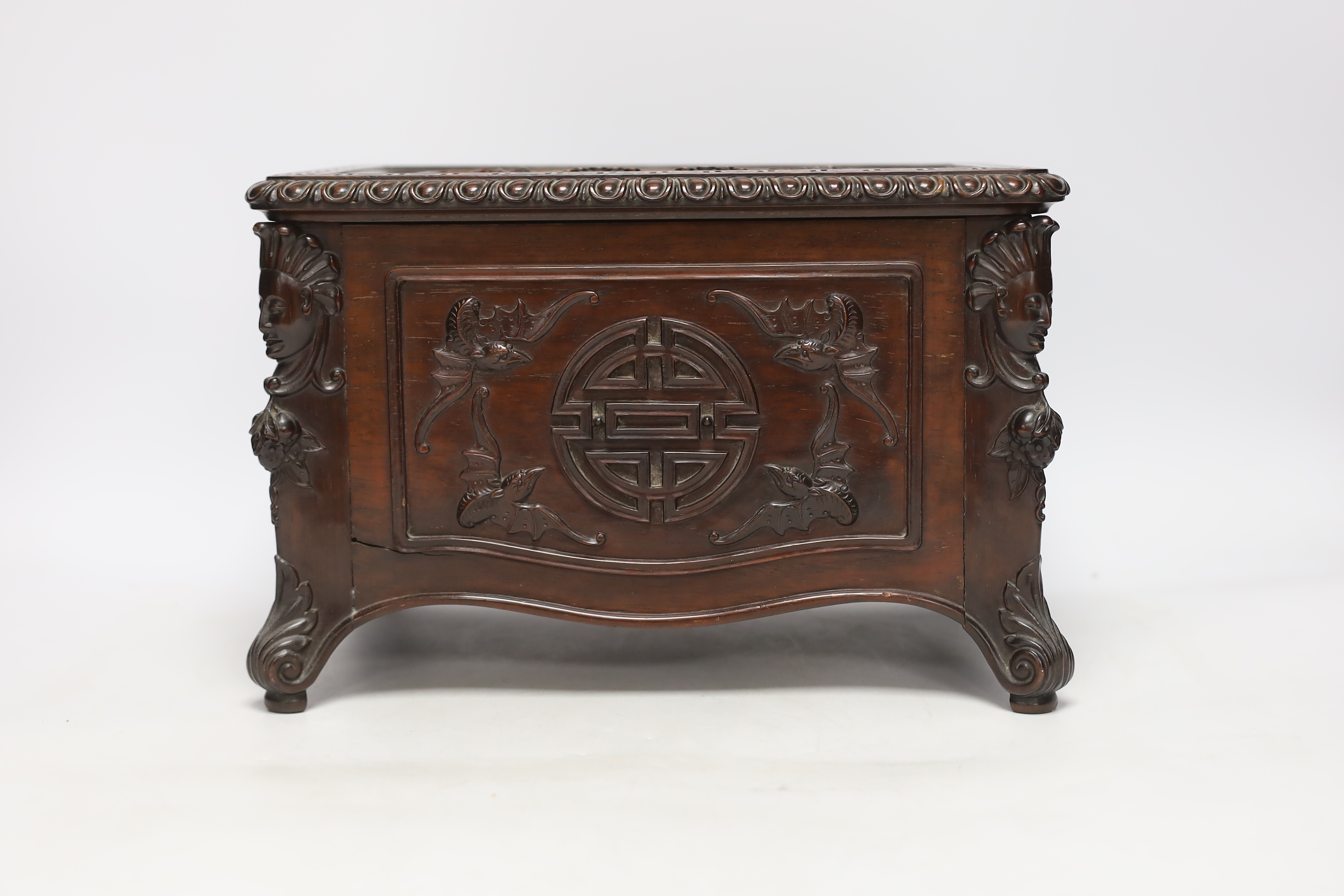 An early 20th century Chinese hongmu wood casket with removable lid and figurative heads on each corner, raised on four feet with G.A.L. carved into the lid, 30cm wide, 20.5cm deep, 20cm high